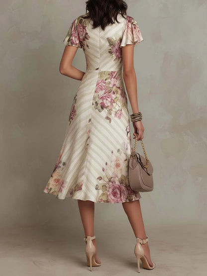 Elegant Ivory Floral Midi Dress for Women with Wrap V Neck Flutter Sleeve Ruched Flowing Style