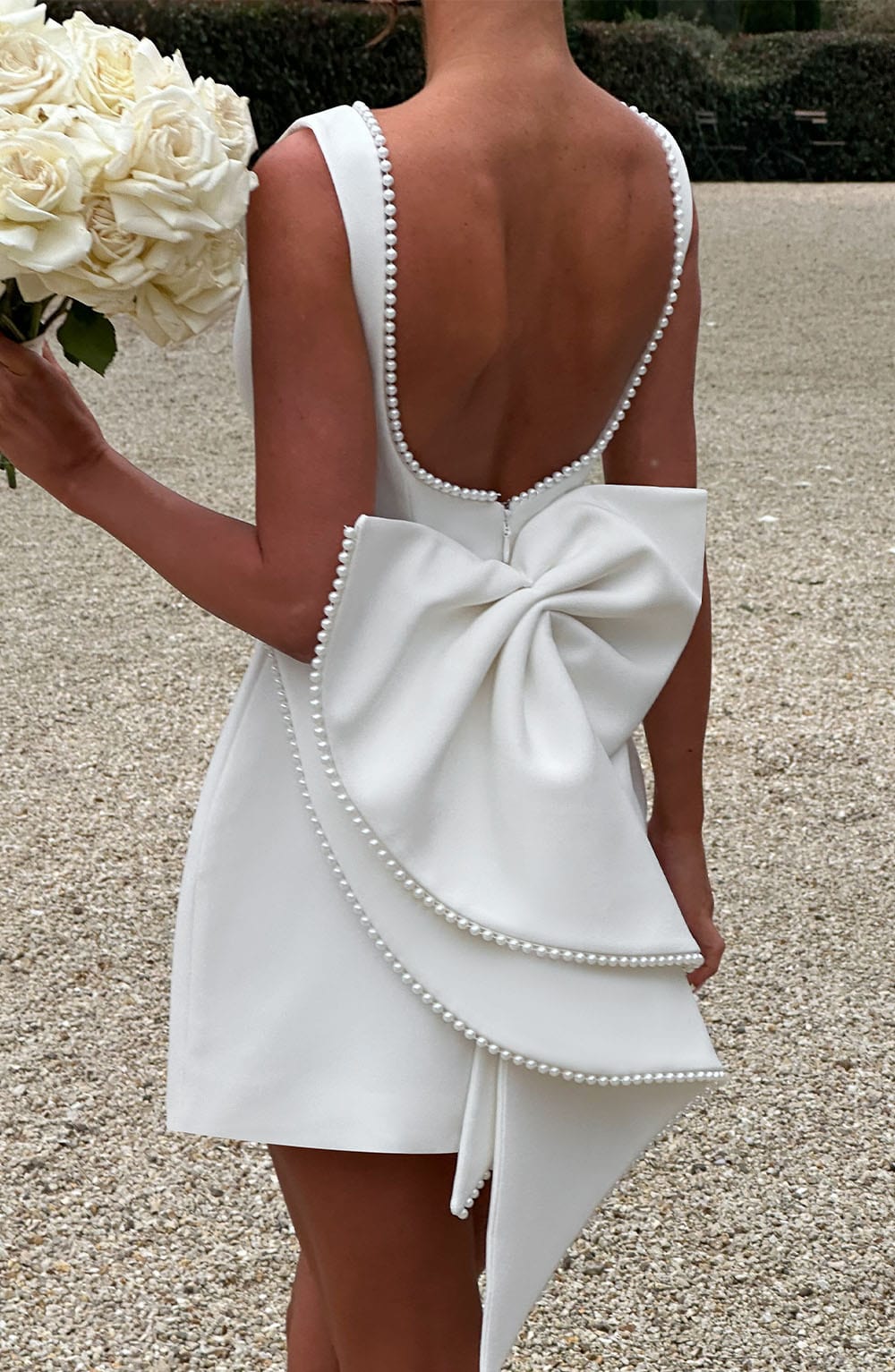 Stylish Mini Dress for Women with Round Neck Sleeveless Bow Back Flared Cocktail Style