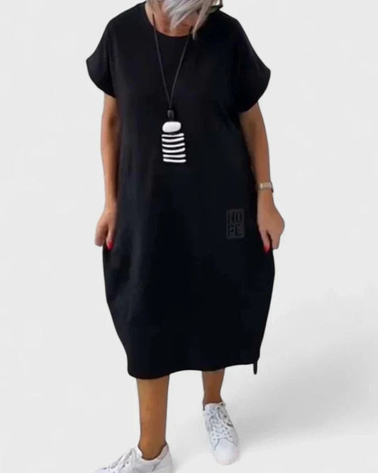 Effortless Black Midi Dress for Women with Crew Neck Short Sleeve Flowing Oversized Pockets Casual Style