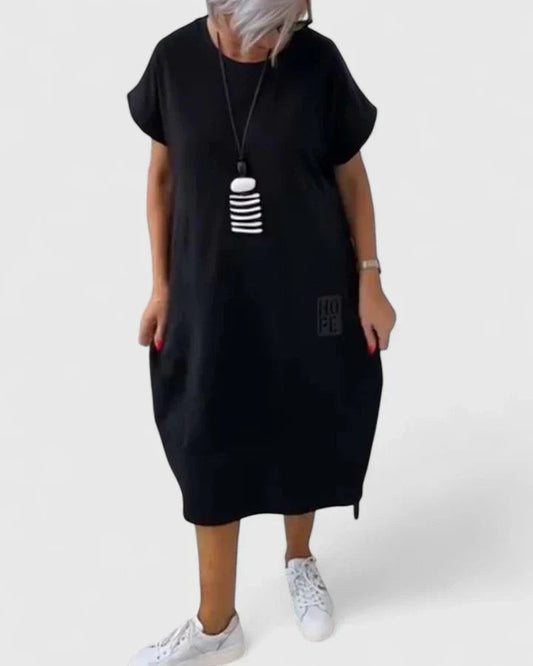 Effortless Black Midi Dress for Women with Crew Neck Short Sleeve Flowing Oversized Pockets Casual Style