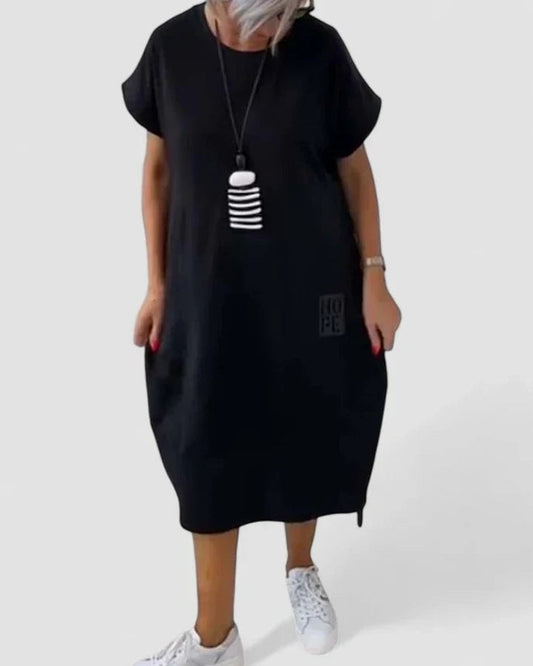 Effortless Black Midi Dress for Women with Crew Neck Short Sleeve Flowing Oversized Pockets Casual Style