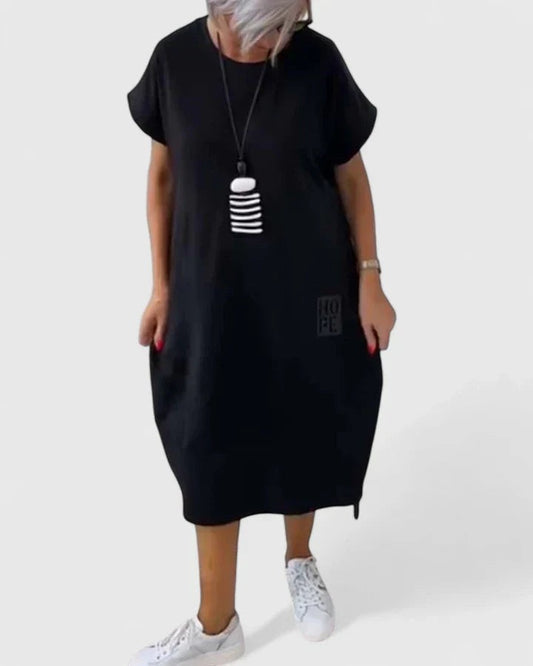 Effortless Black Midi Dress for Women with Crew Neck Short Sleeve Flowing Oversized Pockets Casual Style