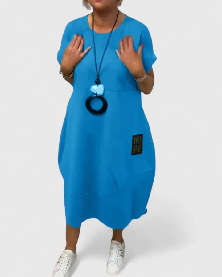 Effortless Black Midi Dress for Women with Crew Neck Short Sleeve Flowing Oversized Pockets Casual Style