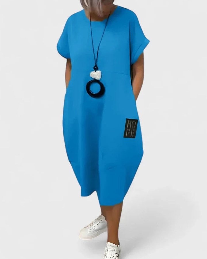 Effortless Black Midi Dress for Women with Crew Neck Short Sleeve Flowing Oversized Pockets Casual Style