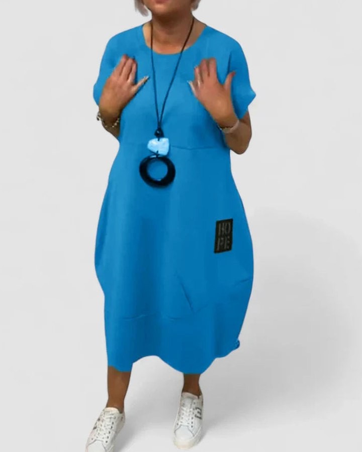 Effortless Black Midi Dress for Women with Crew Neck Short Sleeve Flowing Oversized Pockets Casual Style