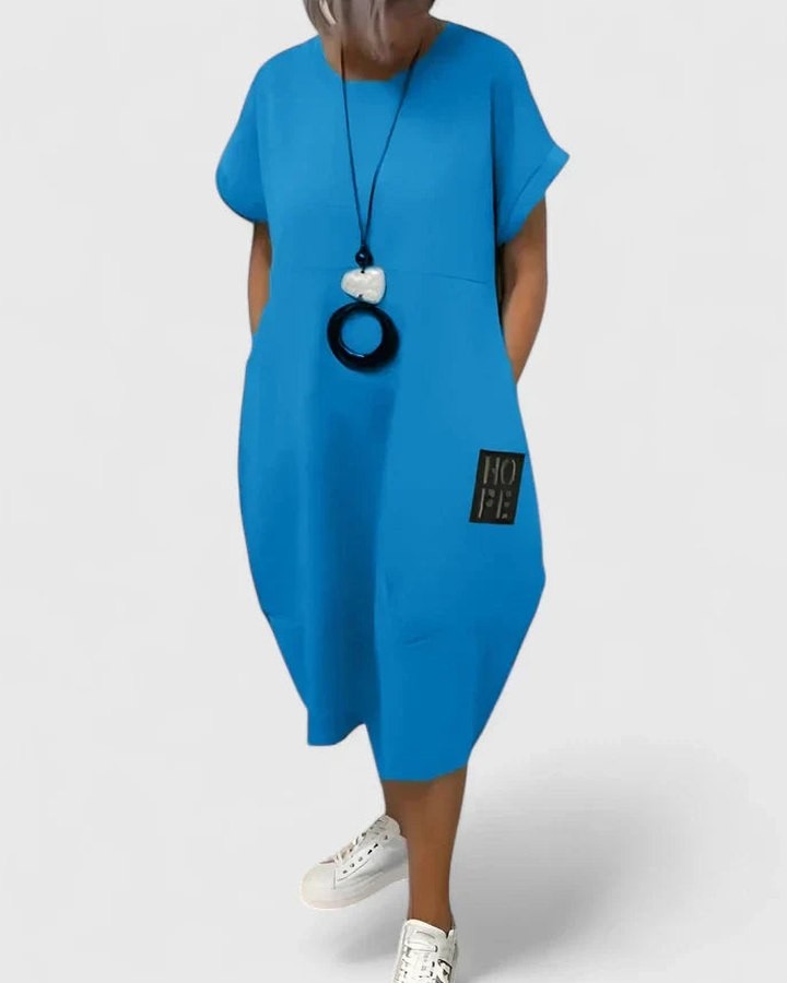 Effortless Black Midi Dress for Women with Crew Neck Short Sleeve Flowing Oversized Pockets Casual Style